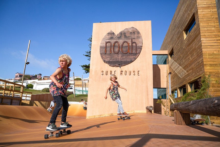 Children skateboard at Noah Surf House adventure hotels