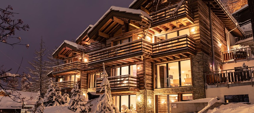 A European chalet lit up at night best chalets