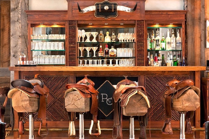 Ranch at Rock Creek hotel bar saddles